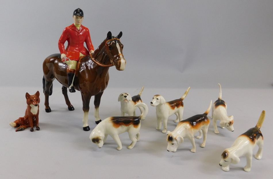 Appraisal: A Beswick ceramic hunting group to include a huntsman with