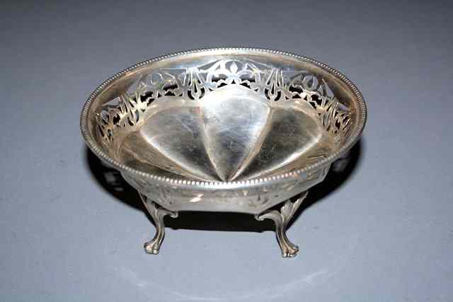 Appraisal: A SILVER BASKET with octagonal panels pierced sides and beaded