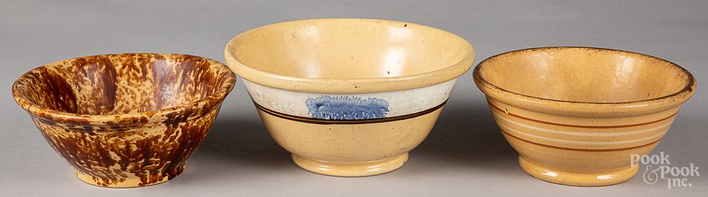 Appraisal: Two yellowware mixing bowls Two yellowware mixing bowls together with