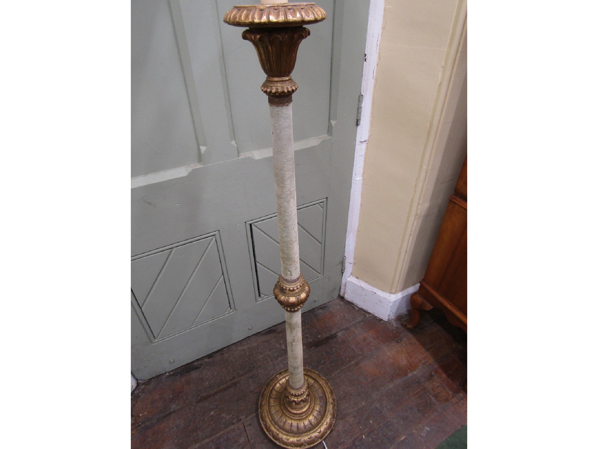 Appraisal: A decorative gilded lamp standard with carved and detailed base