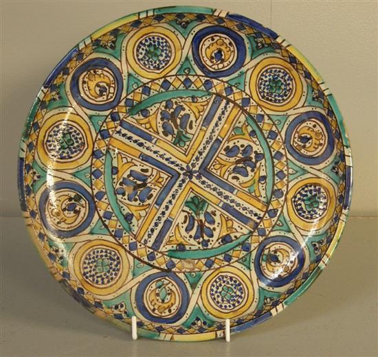 Appraisal: th century North African pottery charger with blue yellow and