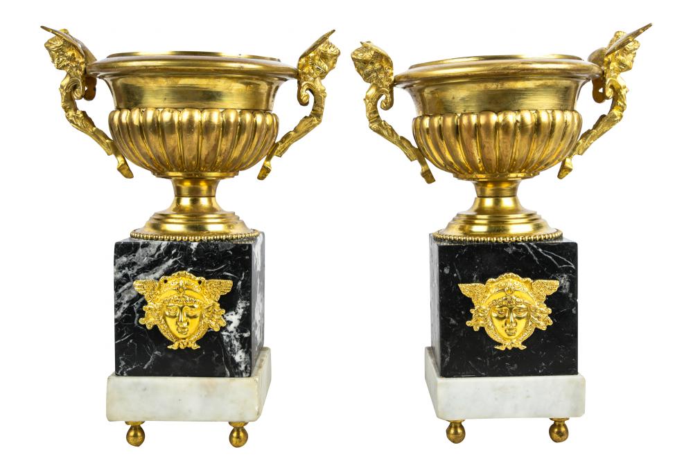 Appraisal: PAIR OF EMPIRE-STYLE GILT BRONZE URNS ON MARBLE BASESmodern each