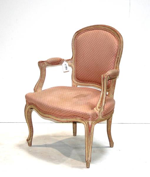 Appraisal: A pair of Louis XV style bleached wood fauteuils mid