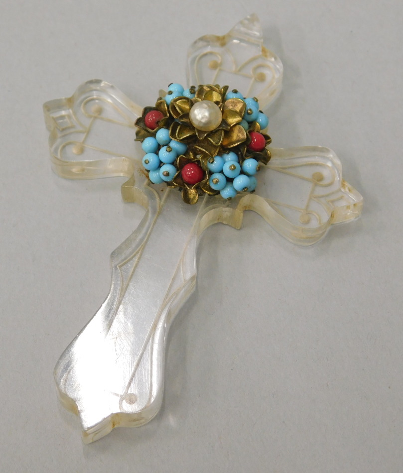 Appraisal: A crucifix with central attached multi coloured beads and pearl