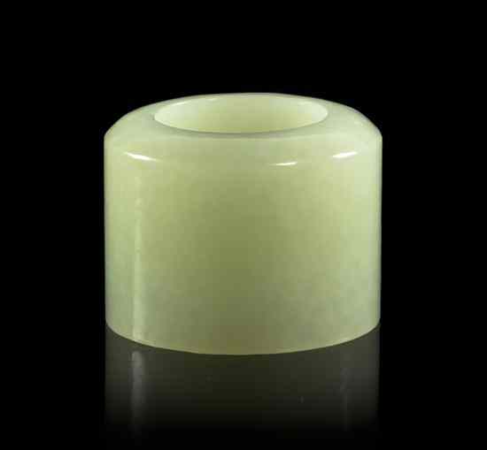 Appraisal: A Jade Archer's Ring of a pale celadon stone one