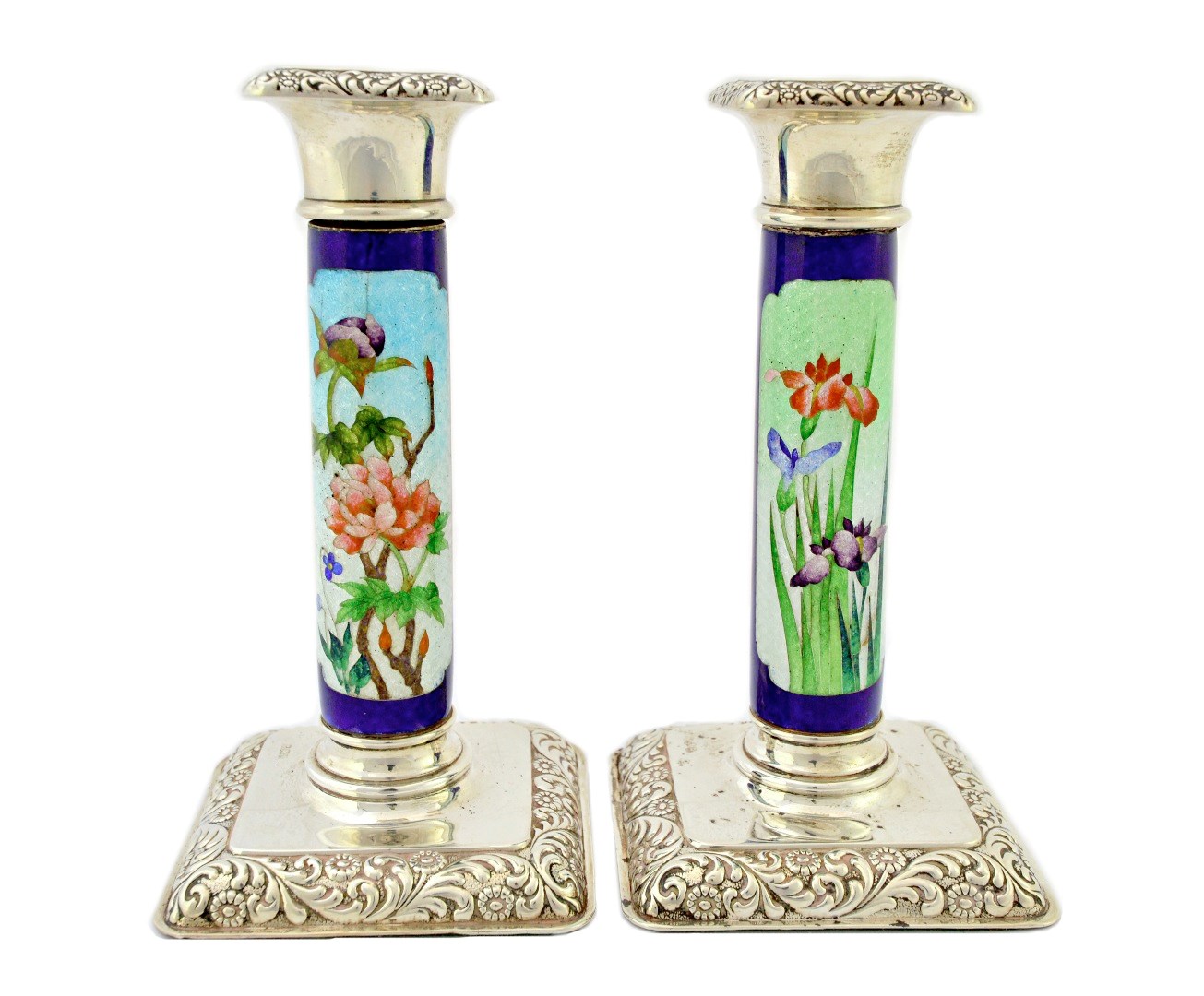 Appraisal: A pair of silver and cloisonne enamelled candlesticks the tops