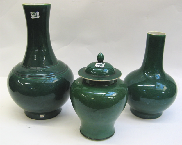 Appraisal: CHINESE EMERALD GREEN GLAZED POTTERY PIECES two bottle-form vases white