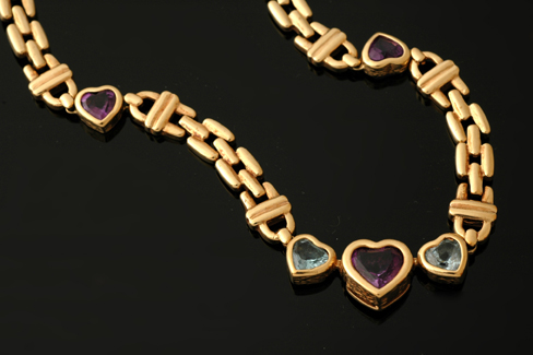 Appraisal: AMETHYST AND AQUAMARINE HEART NECKLACE SET IN CT GOLD