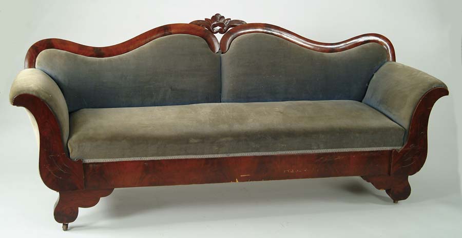 Appraisal: VICTORIAN MAHOGANY SOFA Curving two section back with central leaf