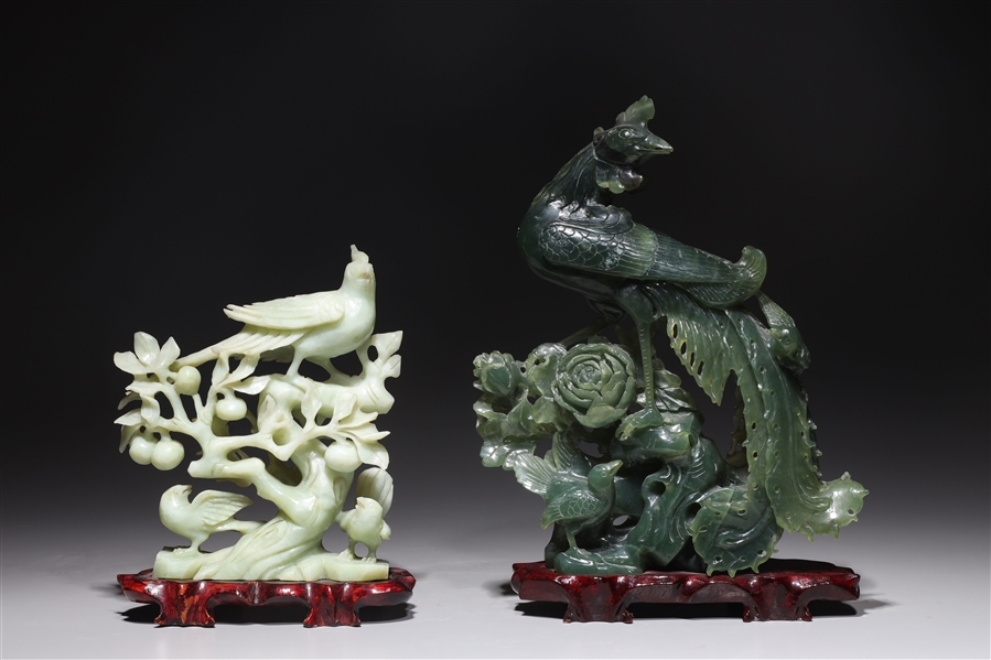 Appraisal: Two Chinese carved hardstone phoenix birds each with wood stand