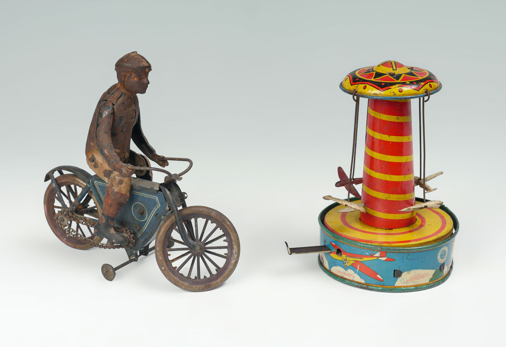 Appraisal: TIN WIND UP TOYS Comprising - Four Airplane Whirly Gig