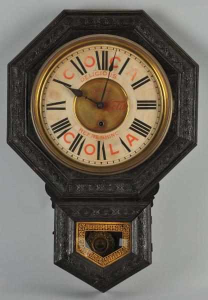 Appraisal: Early Coca-Cola Schoolhouse Octagonal Clock Description Embossed oak surfaces are