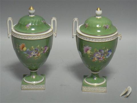 Appraisal: PAIR OF ITALIAN COVERED URNS With gilt-highlighted upswept handles and