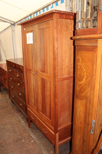 Appraisal: A TH CENTURY POSSIBLY CHERRY WOOD WARDROBE by John Kelly