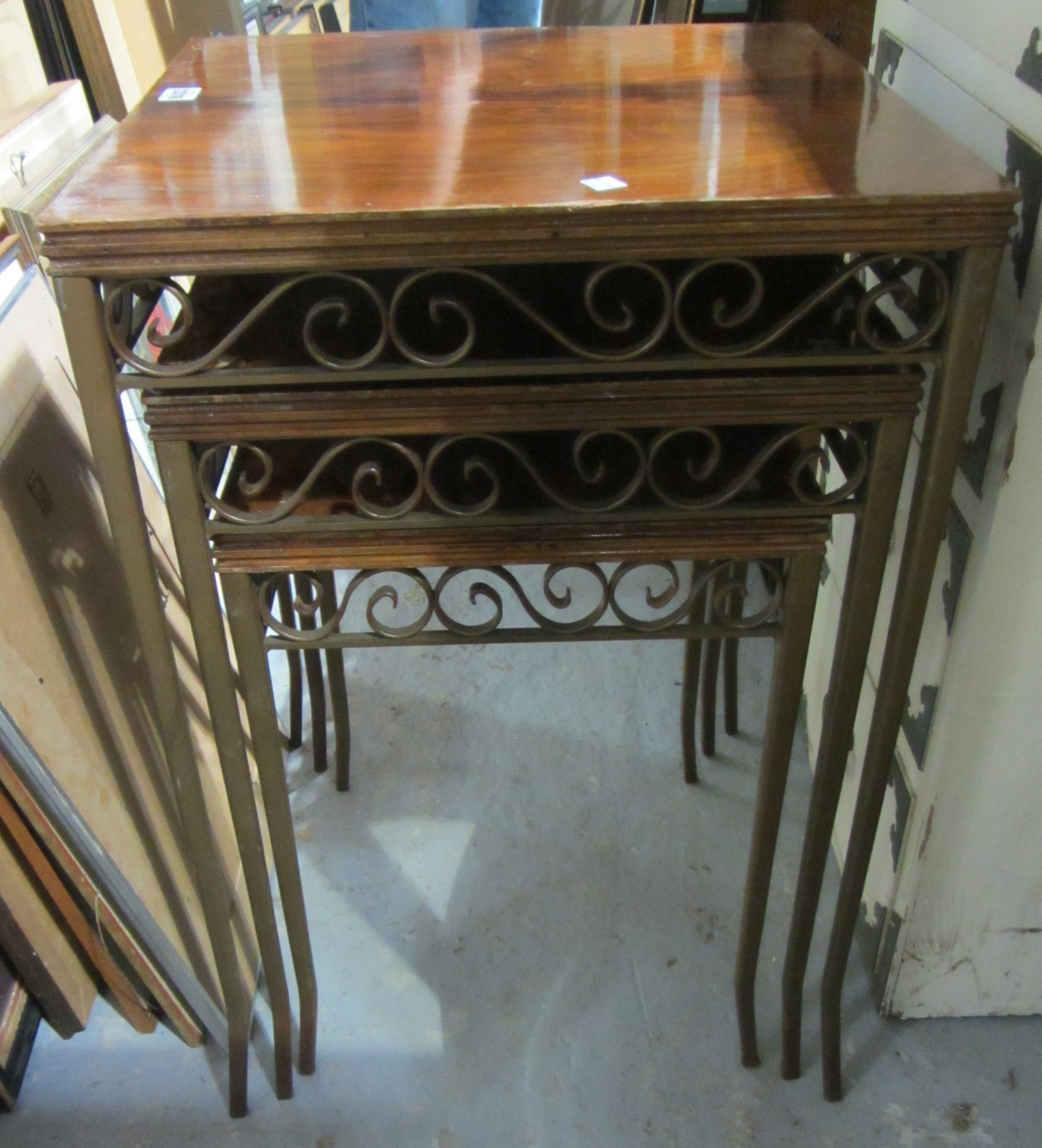 Appraisal: A nest of three walnut and metal tables and a