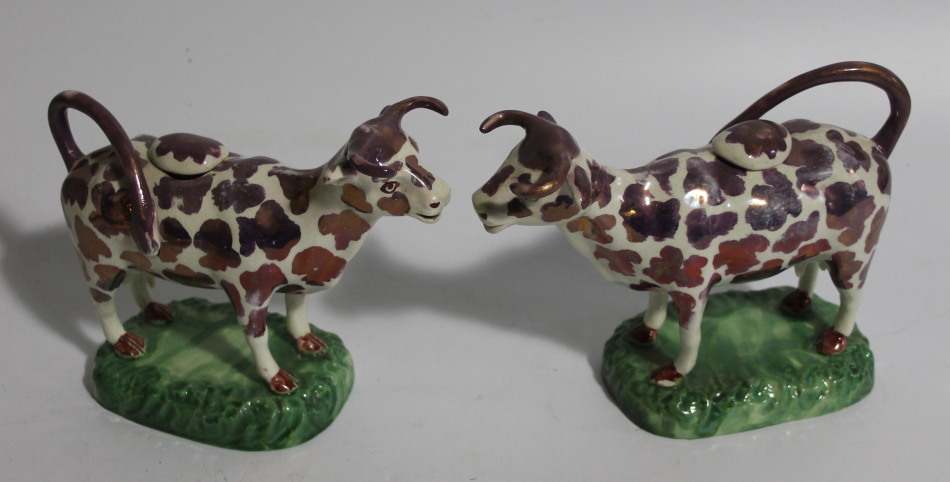 Appraisal: A pair of thC Staffordshire pink lustre cow creamers each