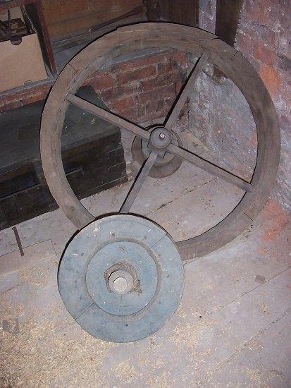 Appraisal: A large wood pulley and another smaller