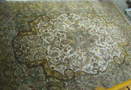 Appraisal: HAND KNOTTED ORIENTAL CARPET Indo-Persian central medallion and overall scrolling