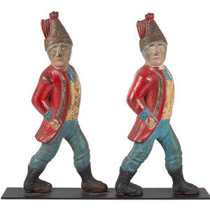 Appraisal: A Pair of Paint Decorated Cast-Iron Hessian Soldier Andiron Supports