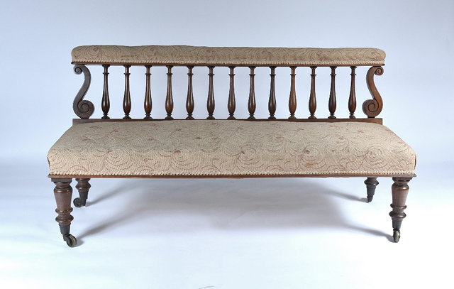 Appraisal: A Victorian upholstered window seat or small setteethe open back