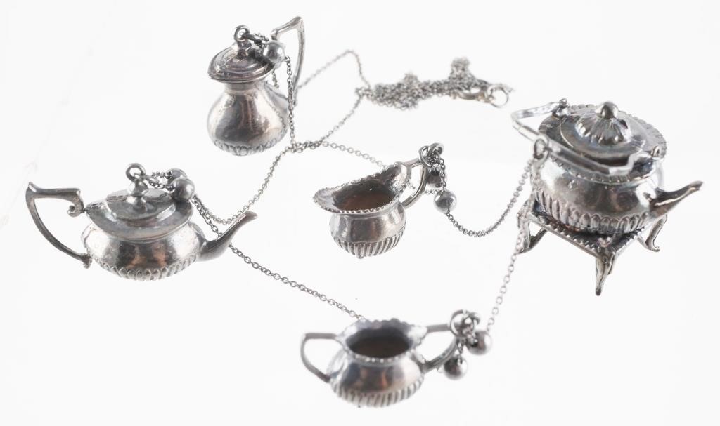 Appraisal: Vintage sterling silver dollhouse miniature tea set made into a