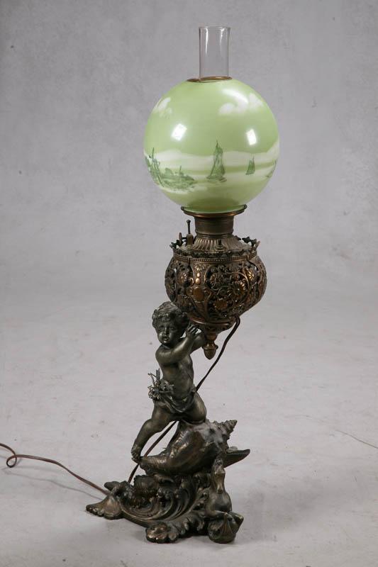 Appraisal: BANQUET LAMP Figural lamp with a cherub sitting on a