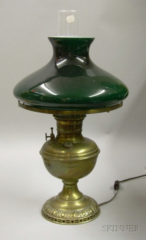 Appraisal: Brass Kerosene Lamp with Cased Green Glass Shade electrified shade