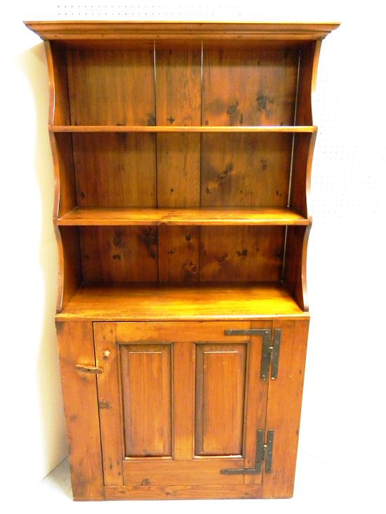 Appraisal: Hutch with shaped sides three shelves over double panel door