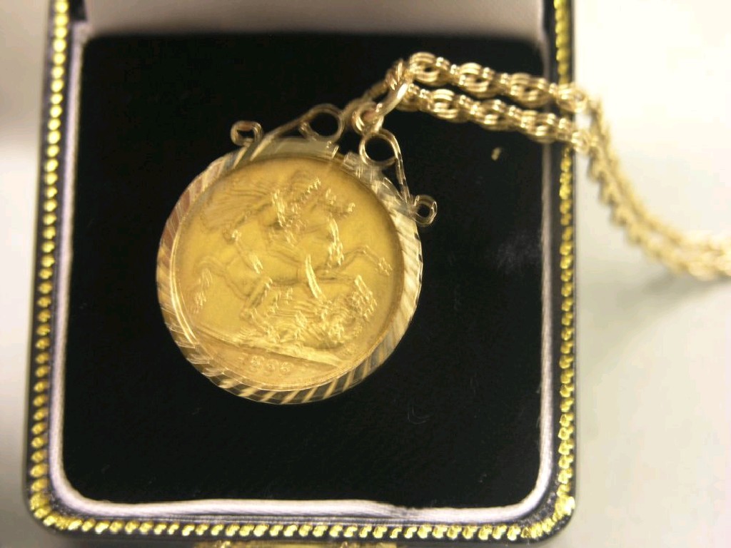 Appraisal: A gold sovereign within yellow metal mount on chain