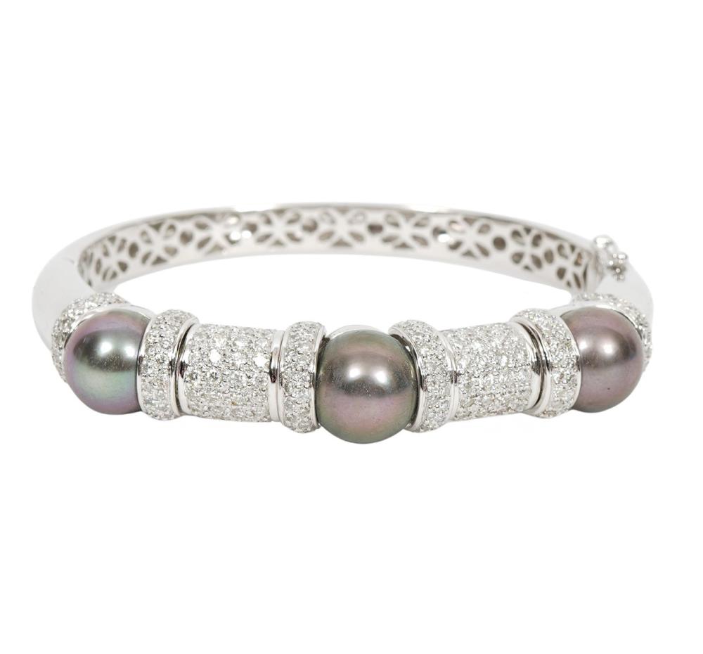 Appraisal: Contemporary diamond black pearl and K white gold hinged bangle