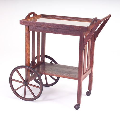 Appraisal: STICKLEY BROTHERS Tea cart with slatted sides large wheels and