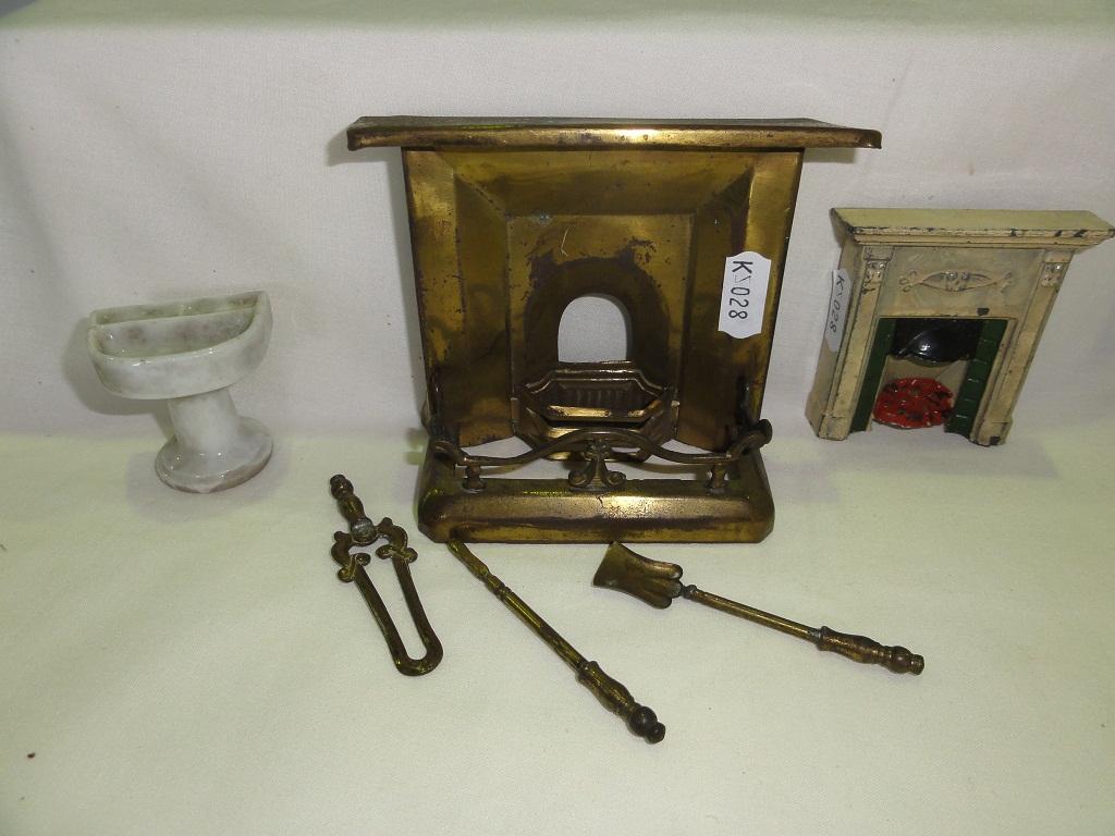 Appraisal: A miniature brass fire surround together with matching fire kerb