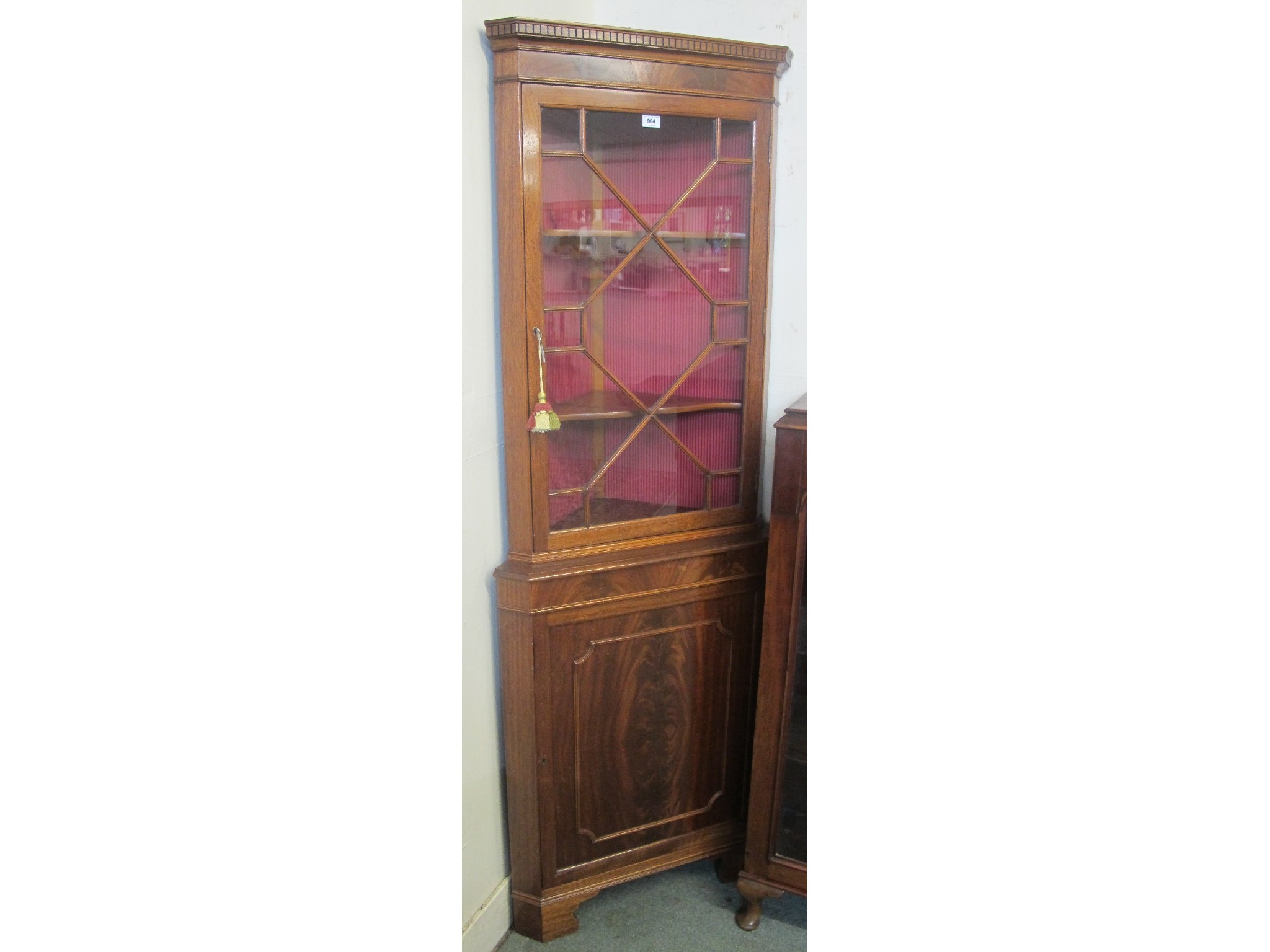 Appraisal: A mahogany corner display cabinet