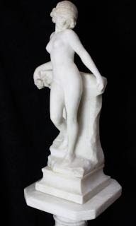 Appraisal: Classical style marble figural sculpture depicting a nude beauty carrying