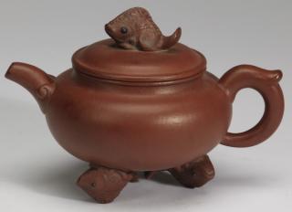 Appraisal: Chinese Yixing fish teapot l Chinese Yixing teapot having a