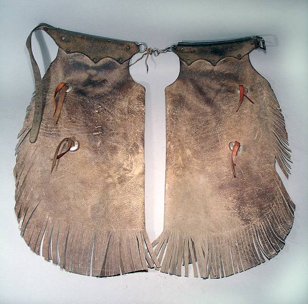 Appraisal: A pair of fringed chinks The tan leather chaps with