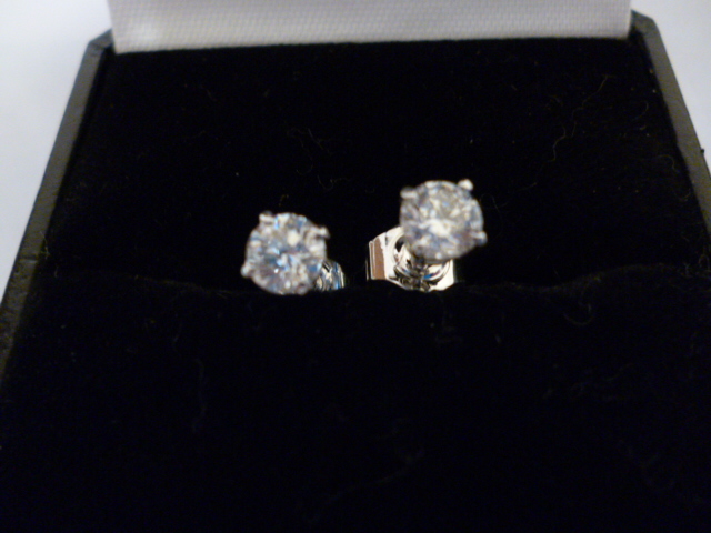 Appraisal: A PAIR OF DIAMOND STUD EARRINGS the brilliant cut stones