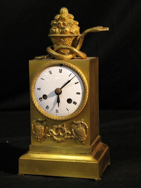 Appraisal: FRENCH EMPIRE ORMOLU CLOCK Lacking movements retro-fitted to run on