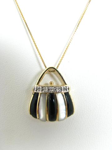 Appraisal: K yellow gold onyx mother-of-pearl purse motif pendant with accent