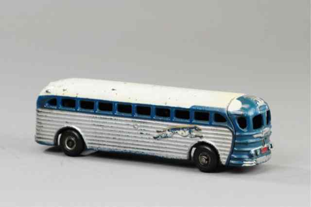 Appraisal: ARCADE GREYHOUND BUS Cast iron painted in silver blue and