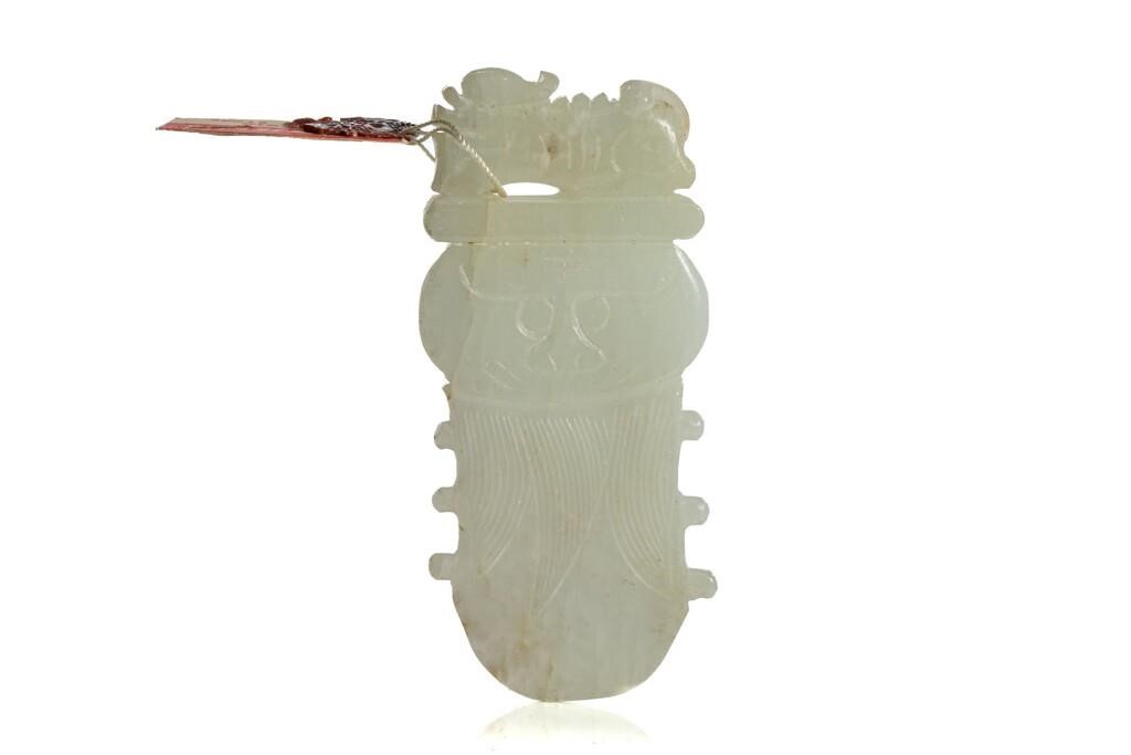 Appraisal: Chinese late Qing dynasty Celadon-white jade carved pendant in form