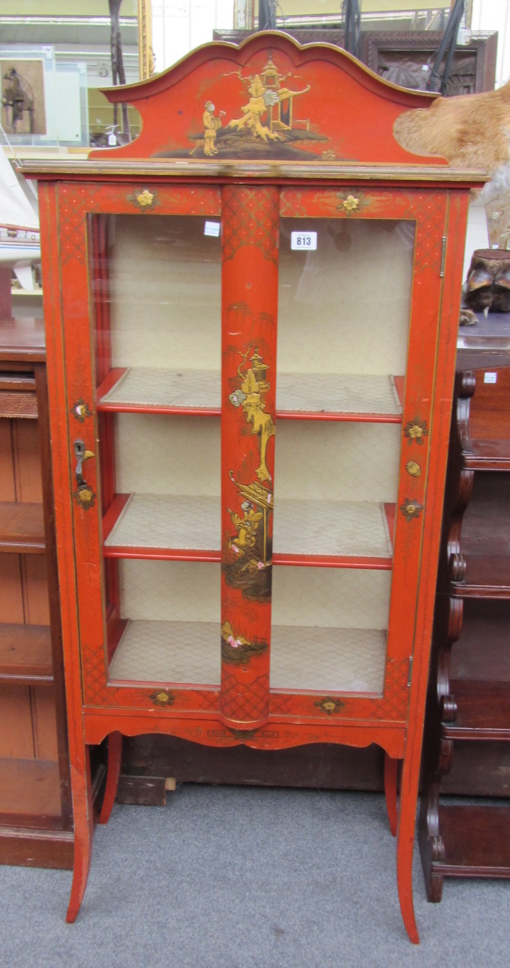 Appraisal: An early th century scarlet lacquered single door glazed display