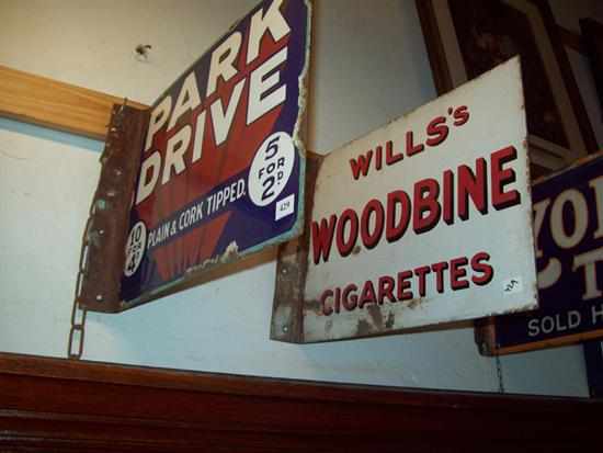 Appraisal: AN ANTIQUE PARK DRIVE ENAMEL SIGN AND A WILLS WOODBINE