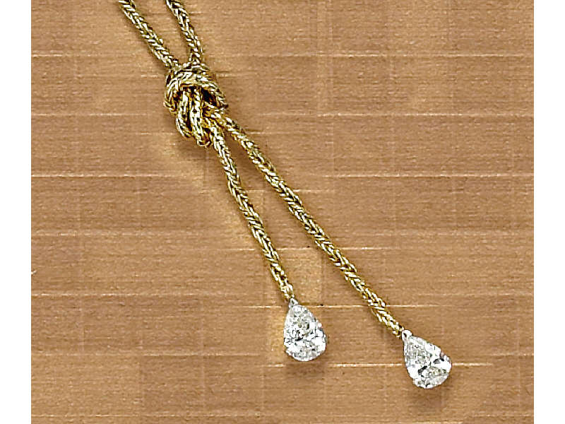 Appraisal: DIAMOND NECKLACE k yellow gold lariat style necklace with pear