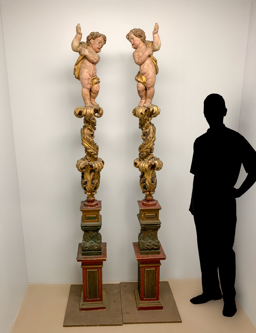 Appraisal: OPPOSING CARVED WOODEN ITALIAN BAROQUE CHERUBIC COLUMNS incredibly carved Italian