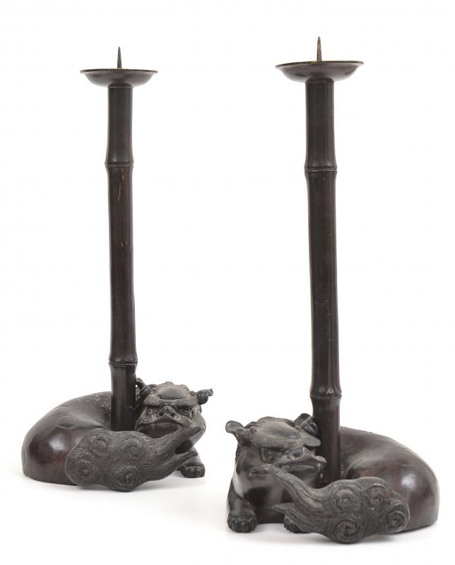 Appraisal: A PAIR OF CHINESE PATINATED METAL FO DOG TORCHERES TH