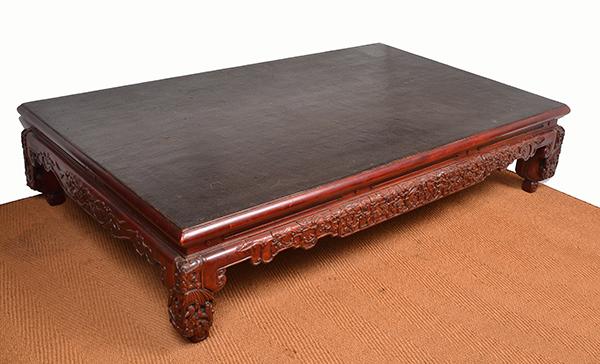 Appraisal: A CHINESE RED AND BLACK LACQUERED OPIUM BED rectangular with