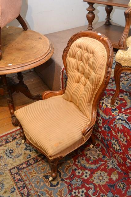 Appraisal: A VICTORIAN WALNUT GENTS CHAIR AND LADIES CHAIR A VICTORIAN