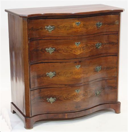 Appraisal: A th century mahogany serpentine chest with four graduated long