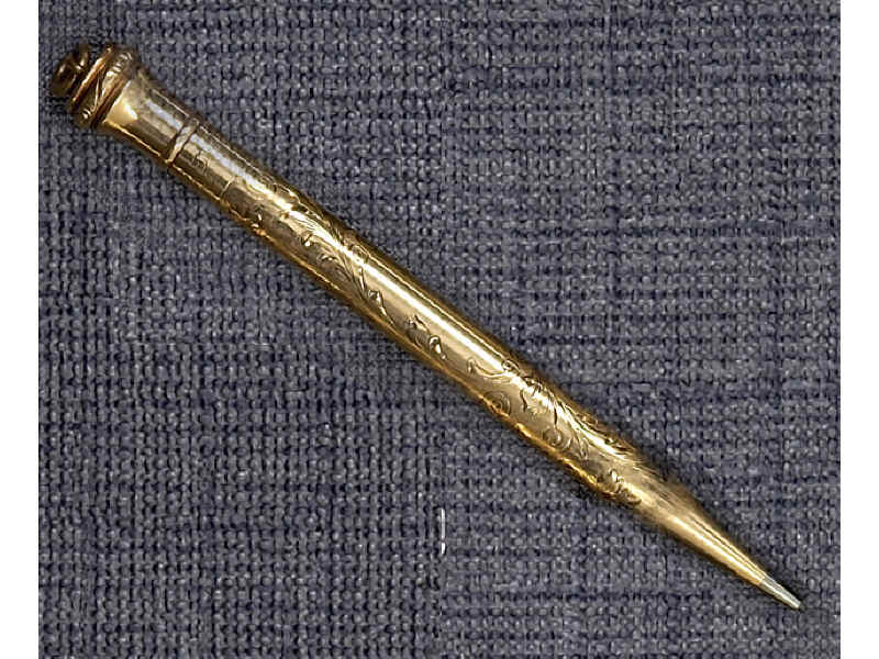 Appraisal: GOLD PENCIL k yellow gold beautifully engraved Eversharp pencil pendant